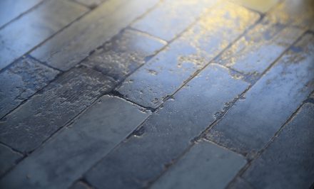 An outside tiled floor made of brick